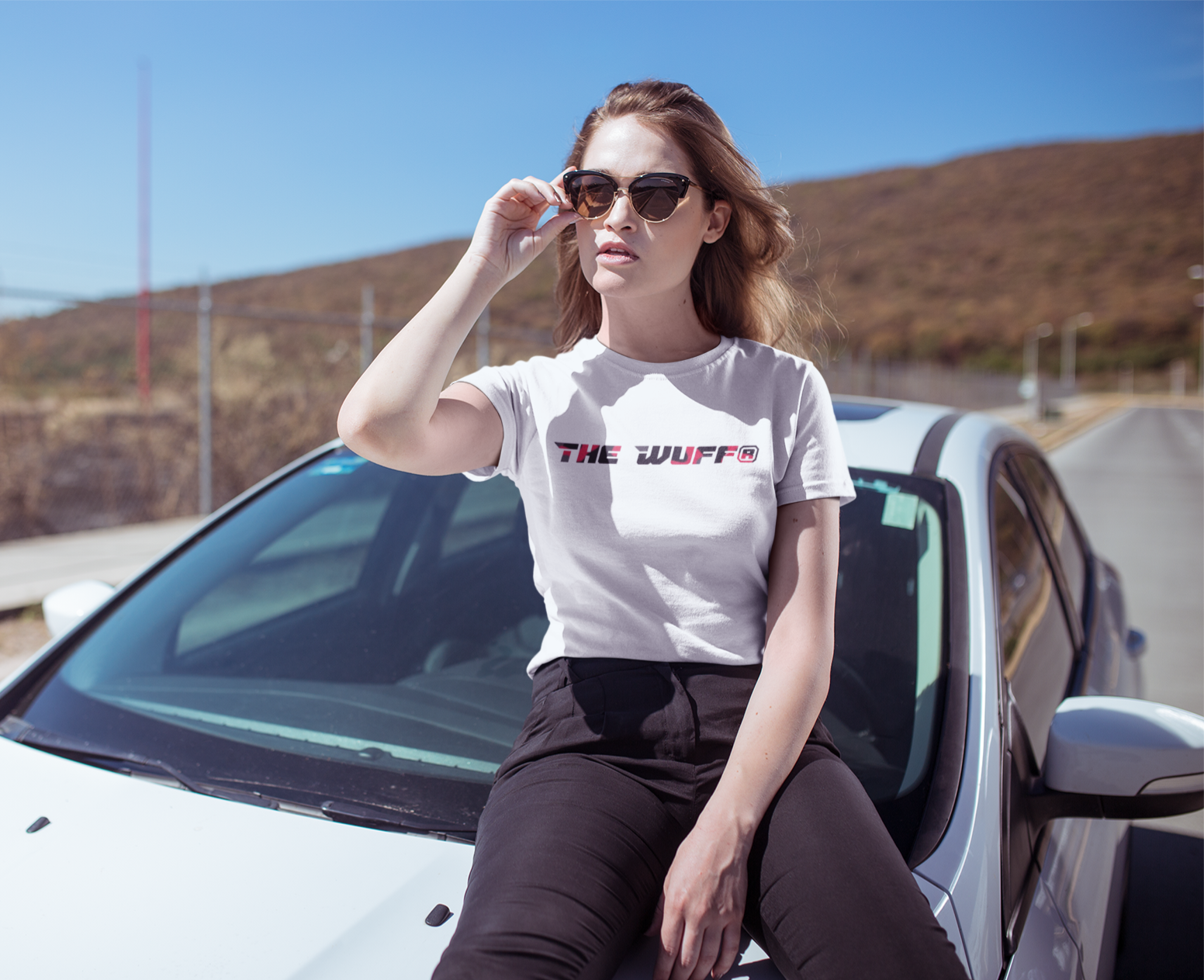 t-shirt-mockup-of-a-cool-and-trendy-woman-sitting-on-a-car-20065.png