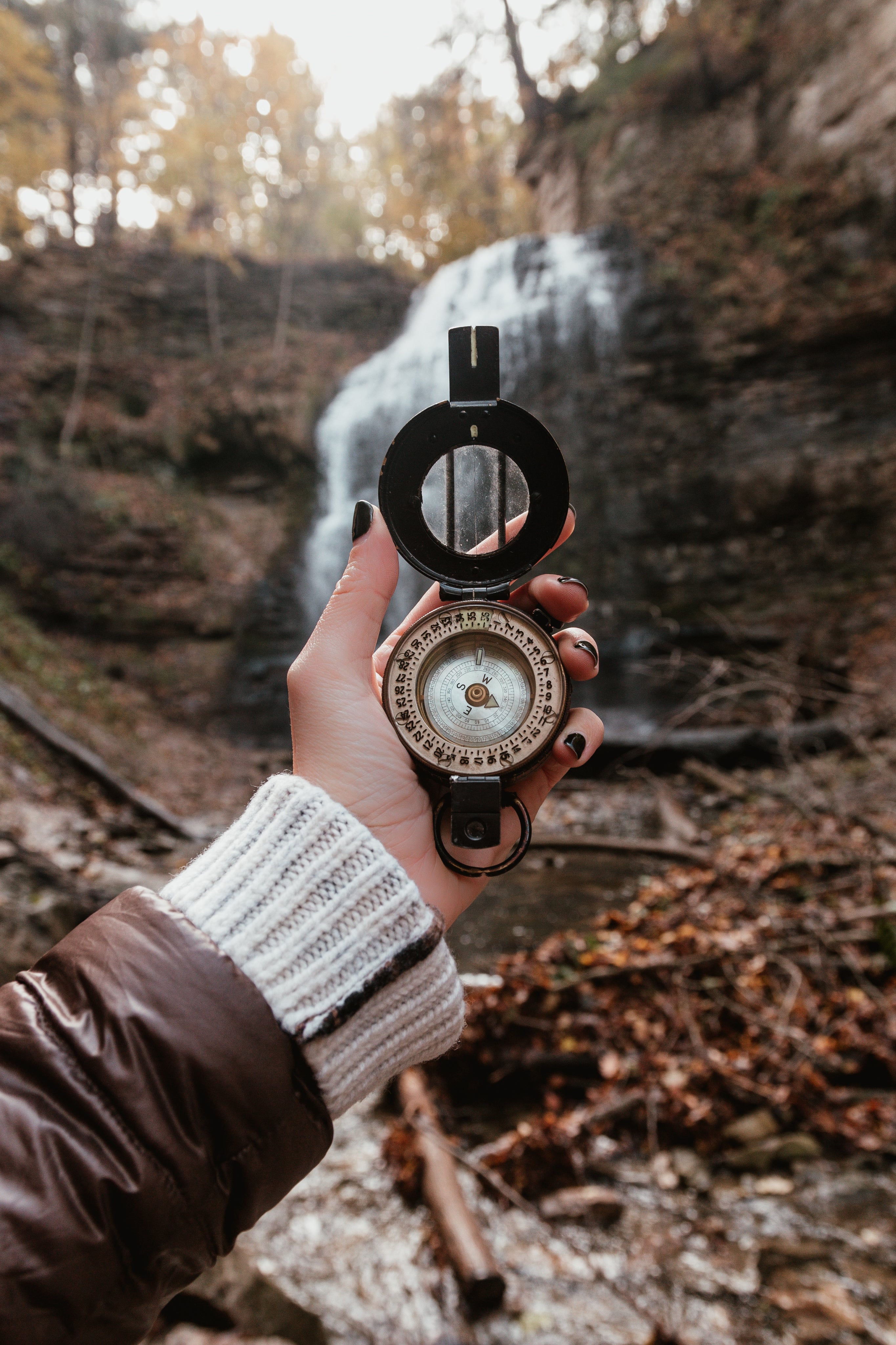 hiking-with-a-compass-near-waterfalls.jpg